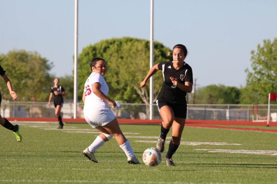 Junior Liv Cerna gets past a defender in a game against Uvalde on March 29. Flour Bluff won 1-0.