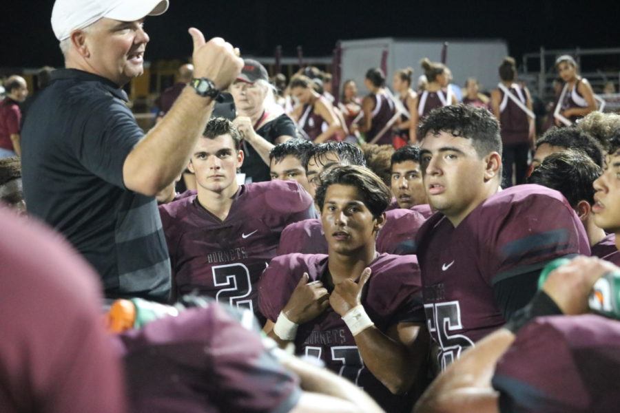 Coach Steinbruck speaks to his players following their 33-38 win against PSJA