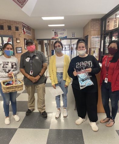 NHS seniors Rosa Navejas, Alicia Flores, and Gracelyn Caudle pose with Security Officer, Miguel Rodriguez, and FBHS receptionist, Melody Vega, after swapping their disposable masks for reusable ones.
